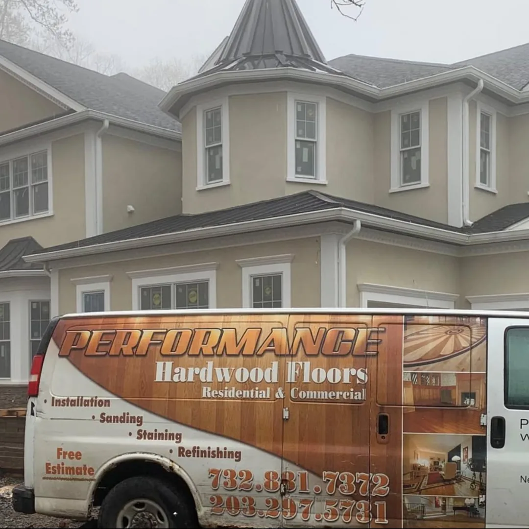Performance Hardwood Floors van by large house