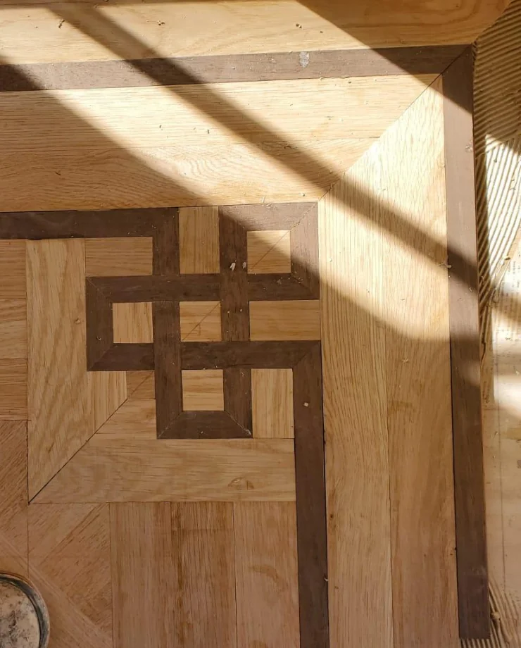 Custom hardwood floor inlay border hand cut by Performance Wood Floor