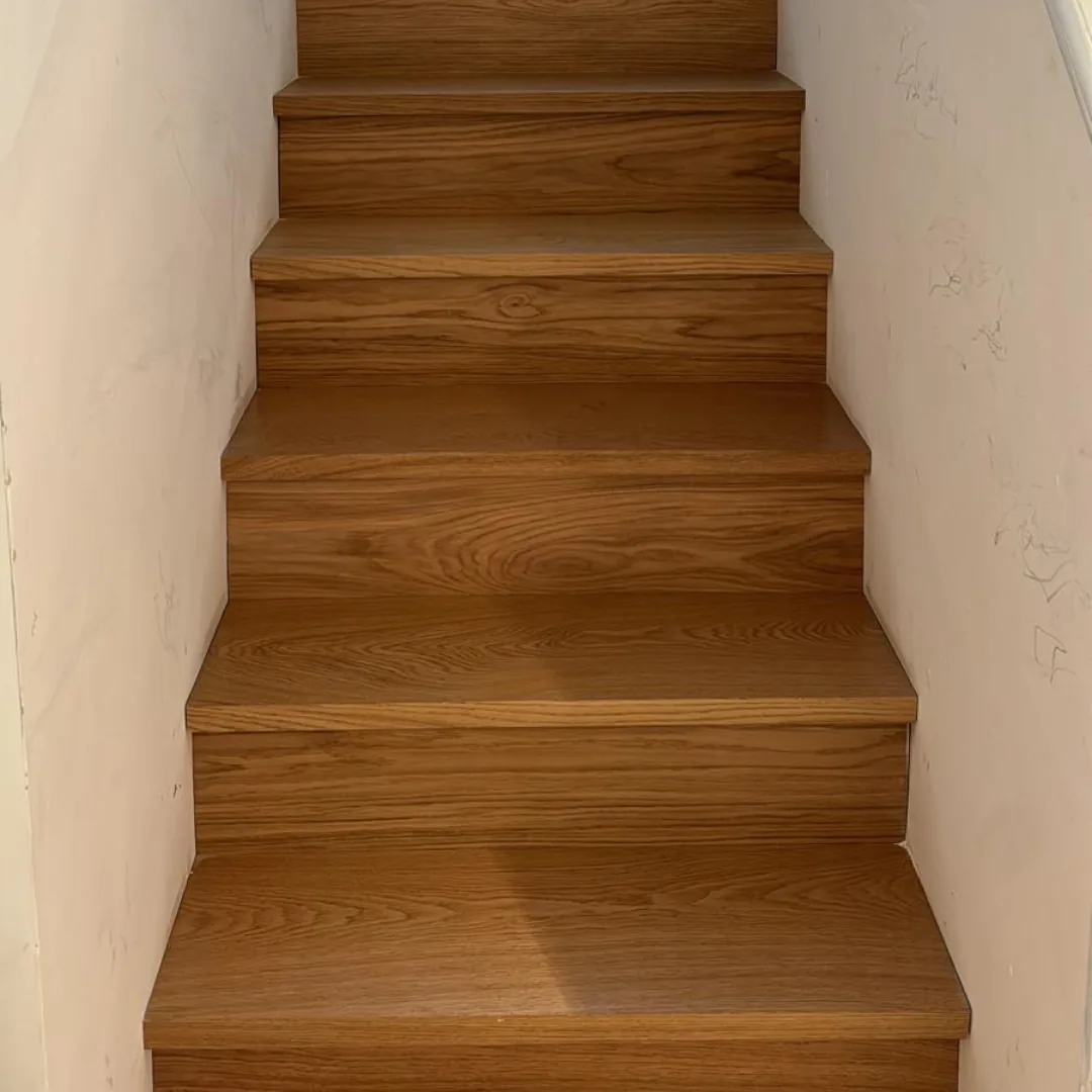 Close-up of newly installed wooden stair treads.