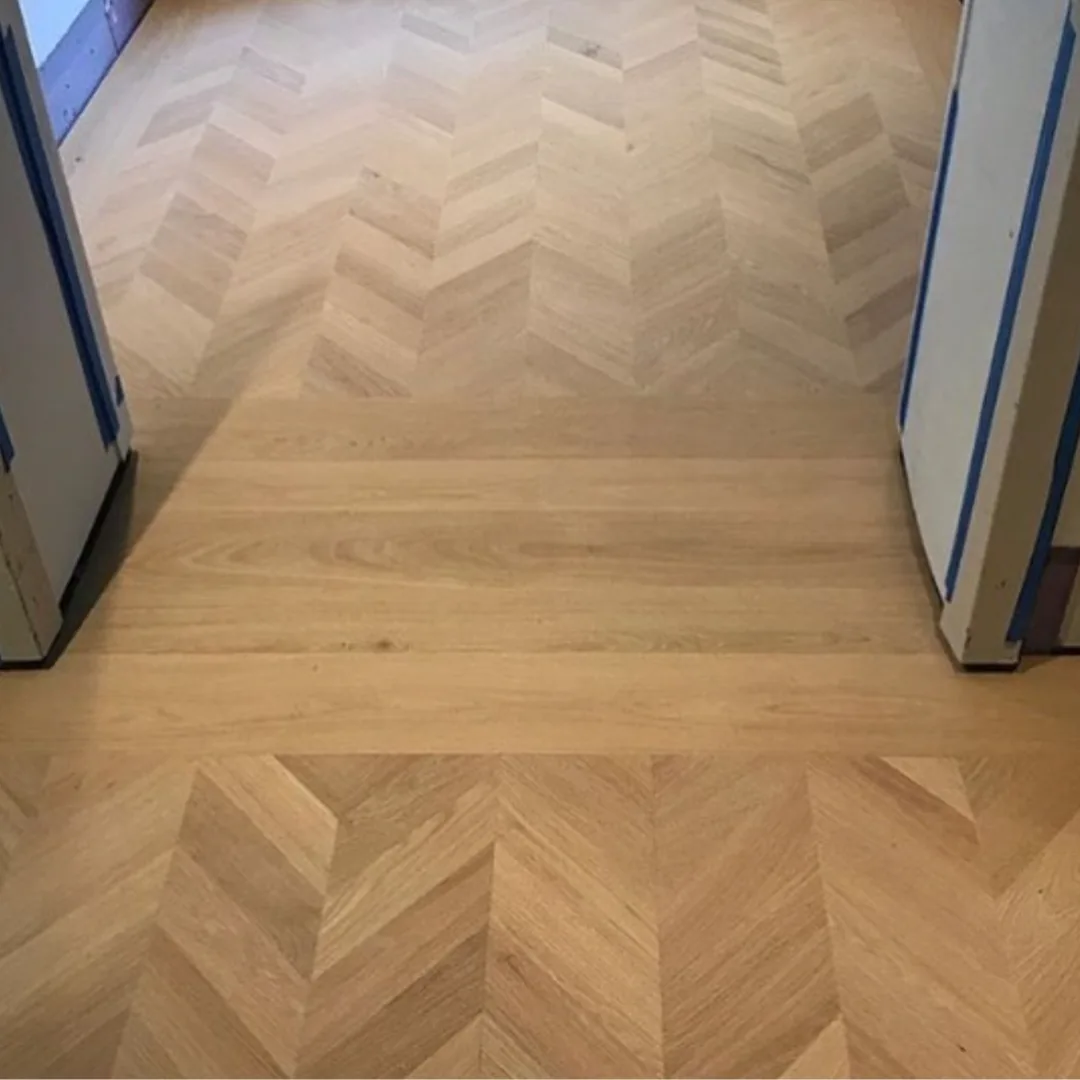 Hardwood flooring with herringbone and plank patterns