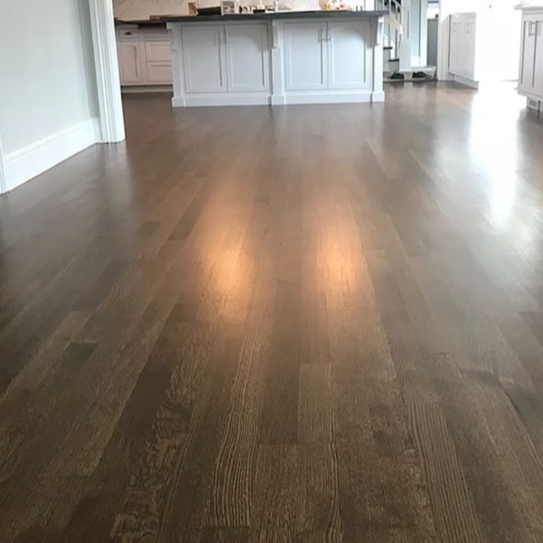 Dark hardwood flooring in kitchen and entryway.