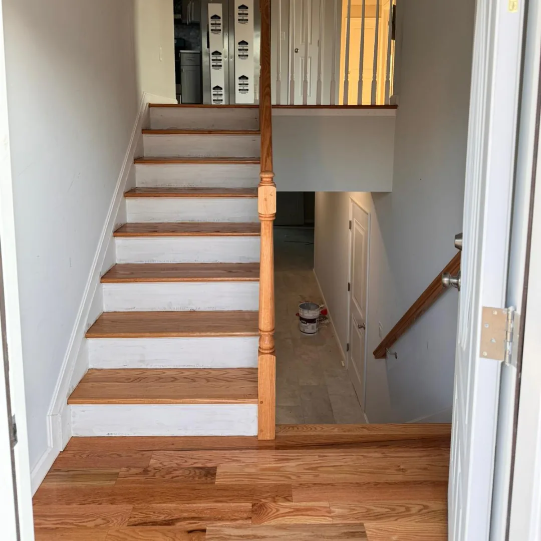 Refinished staircase with oak treads and painted white risers