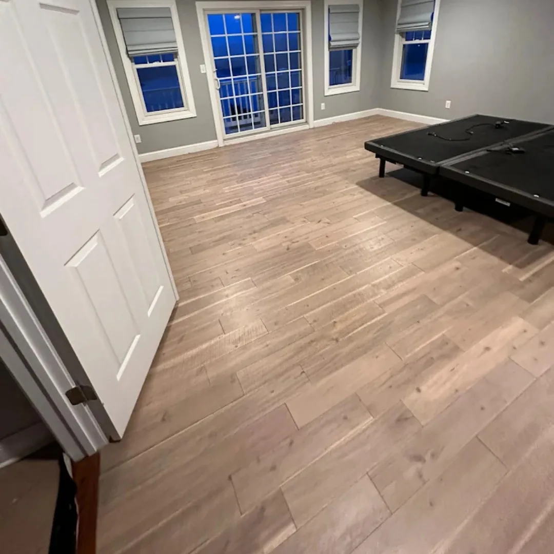 Light wood flooring in a bright room